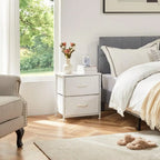 Kaia white nightstand with two drawers beside a bed